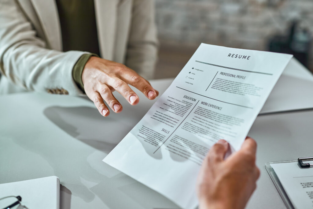 man holding a CV out for insolvency and restructuring interview prep